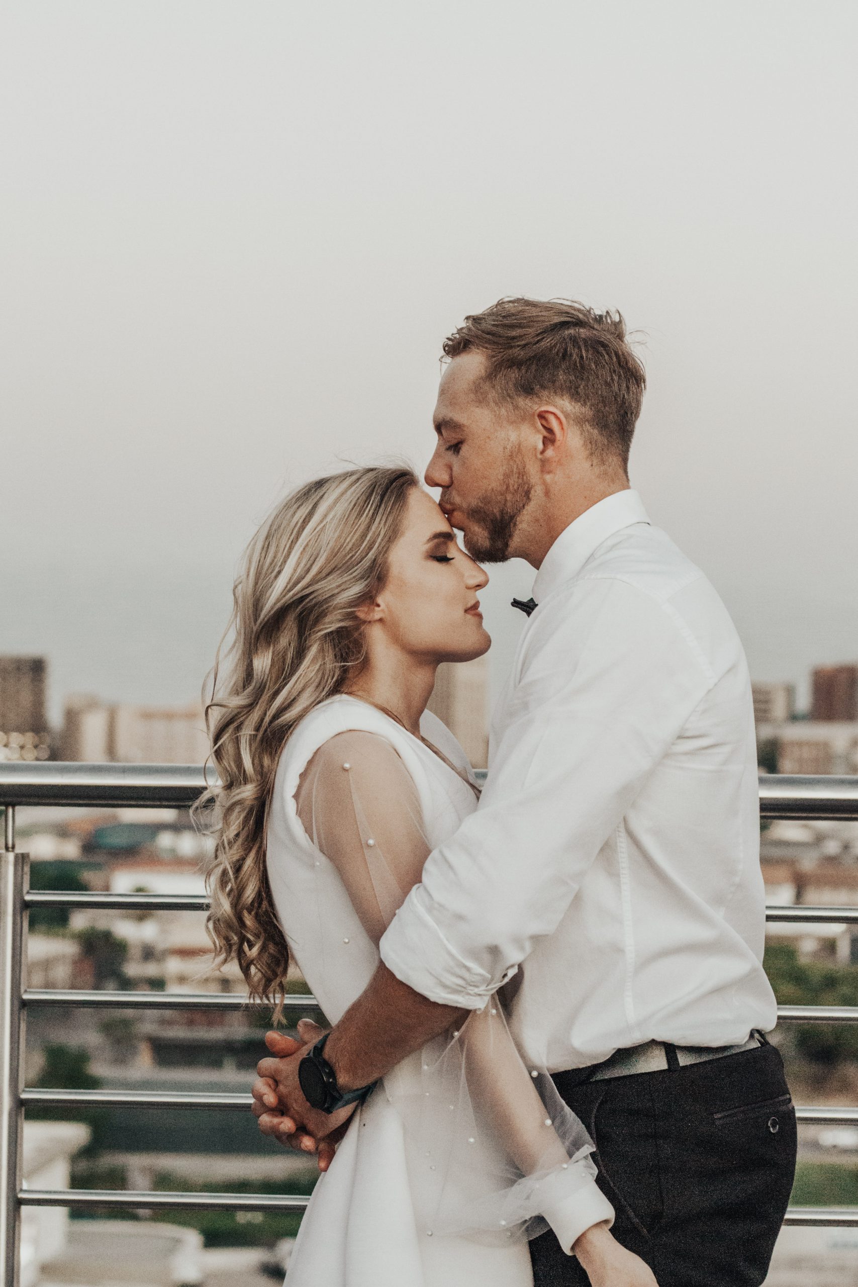 Couple on rooftop at sunset - 2